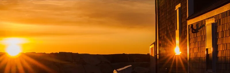 The Studio143 building glowing at sunset